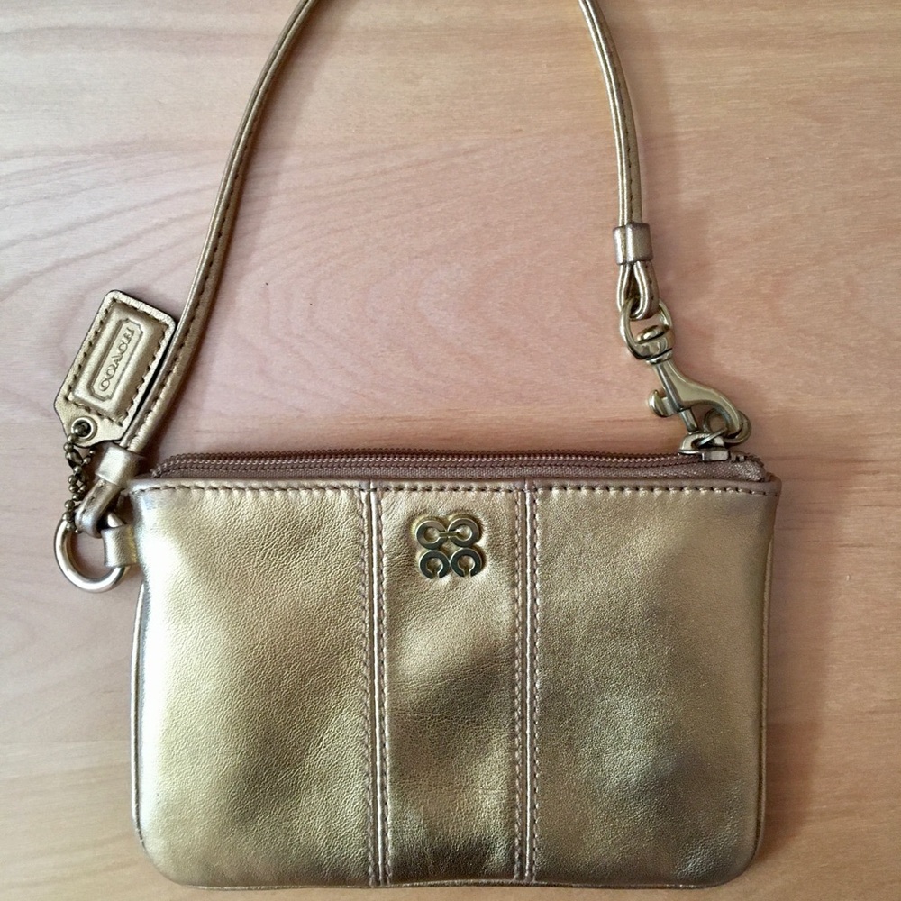 Coach gold clutch wristlet